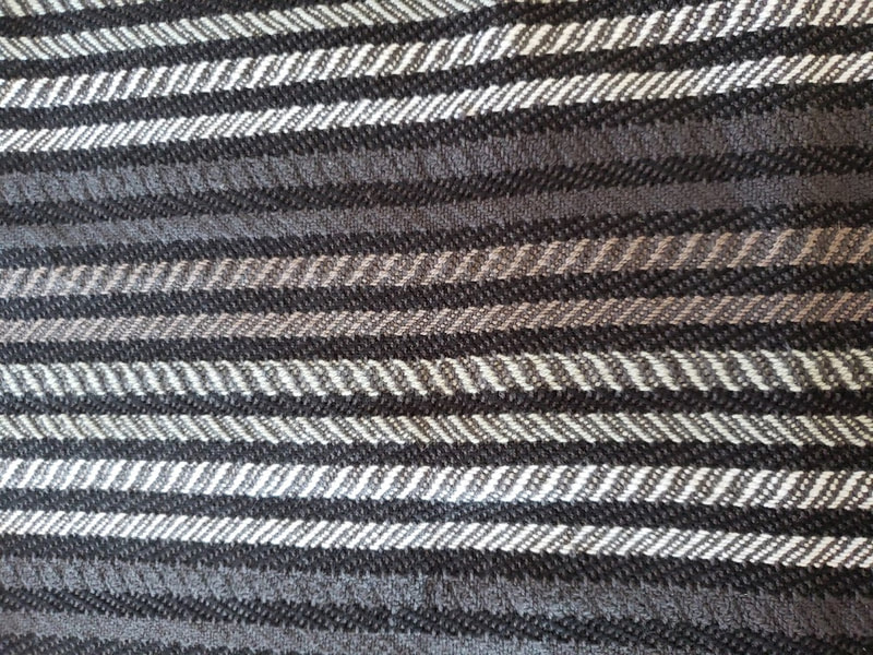 Vertical stripes, woven with charcoal weft thread